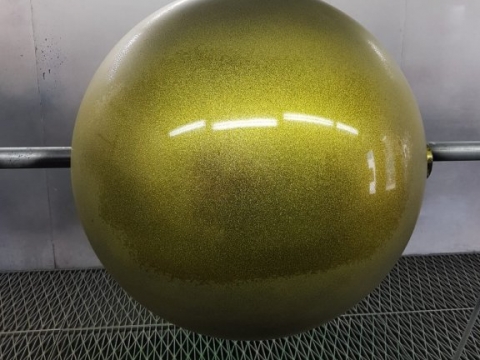 Gold sphere with metallic shimmer coating.